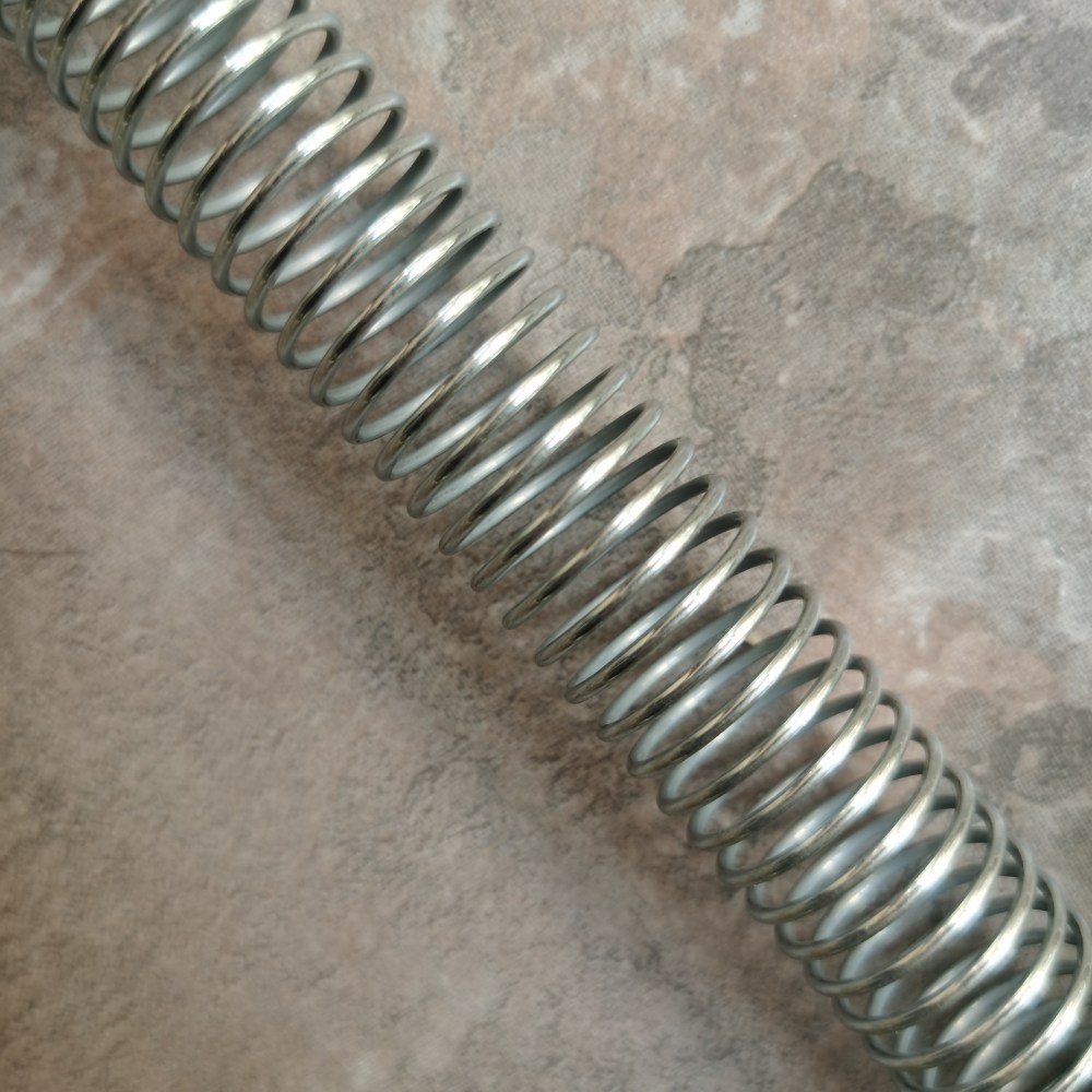 Warum sollte man für Hydraulikschläuche einen Federschlauchschutz aus Edelstahl verwenden?